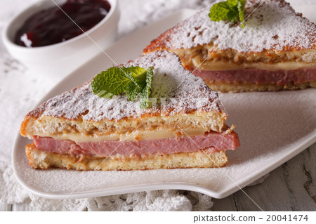 Monte Cristo sandwich close up and berry jam 20041474