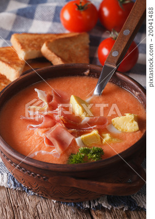 salmorejo soup with ham and eggs closeup in a bowl 20041488