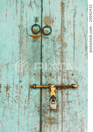 an old wood door with metal handle an old wood door with metal handle 20042432