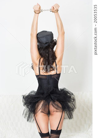 girl in handcuffs standing back. visible ass 20053535