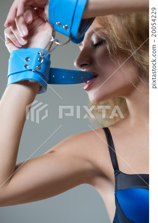 Woman in underwear, bite handcuffs, bdsm, sex toy Woman in underwear, bite handcuffs, bdsm, sex toy 20054229