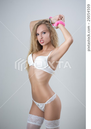Woman in underwear, bite handcuffs, bdsm, sex toy 20054509