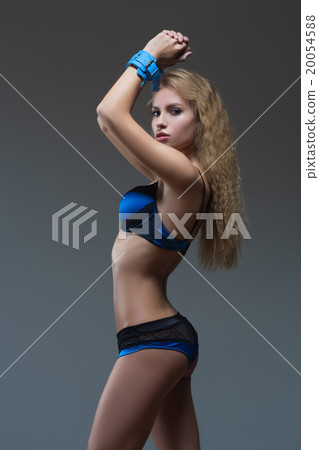 Woman in underwear, bite handcuffs, bdsm, sex toy Woman in underwear, bite handcuffs, bdsm, sex toy 20054588