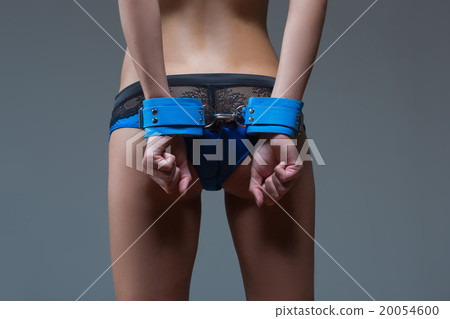 girl in handcuffs standing back. visible ass 20054600