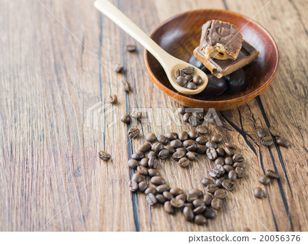 Coffee beans with spoon and chocolate bars. Coffee beans with spoon and chocolate bars. 20056376