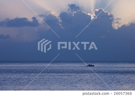 The fishing boat on the sea at sunset 20057368