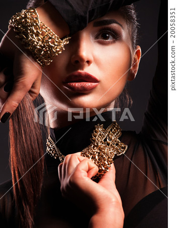 Young beautiful woman in a necklace and bracelet 20058351