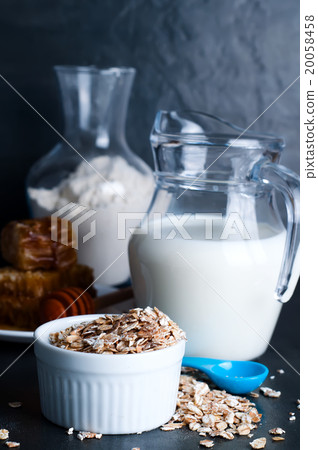 Oatmeal porridge with glass of milk Oatmeal porridge with glass of milk 20058458