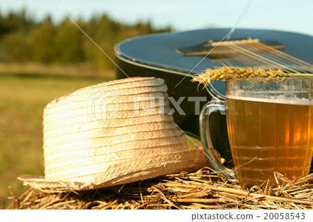 beer in a mug on a haystack 20058543