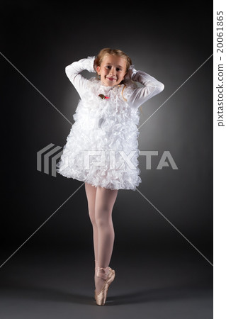 Little ballet dancer posing in white dress Little ballet dancer posing in white dress 20061865