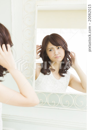 Beauty Image Young woman watching a mirror 20062015