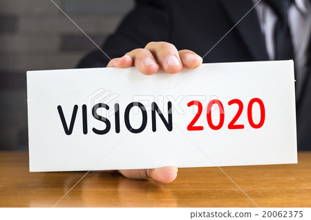 Vision 2020, message on white card by businessman Vision 2020, message on white card by businessman 20062375