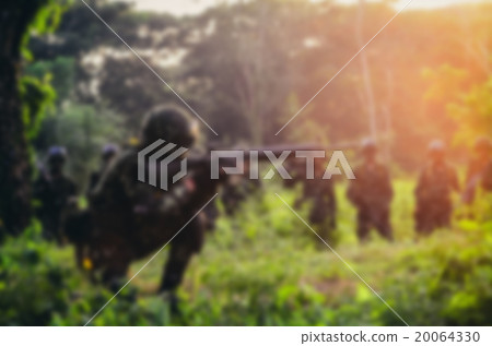 Blurry background soldier maneuver with gun Blurry background soldier maneuver with gun 20064330