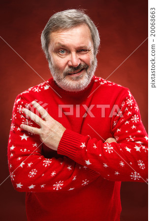 The expressive portrait on red background of a 20068663