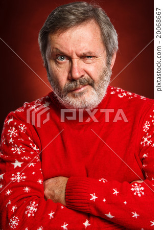 The expressive portrait on red background of a 20068667
