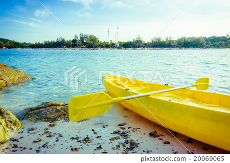 Colorful yellow kayaks on beach in Andaman sea 20069065