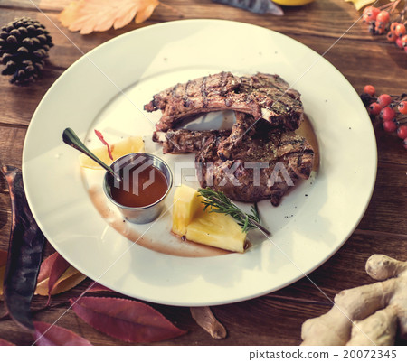 Close up of grilled pork ribs with lemon, sauce Close up of grilled pork ribs with lemon, sauce 20072345