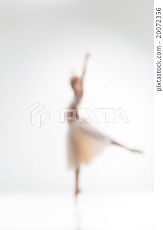 Blurred silhouette of ballerina on white 20072356