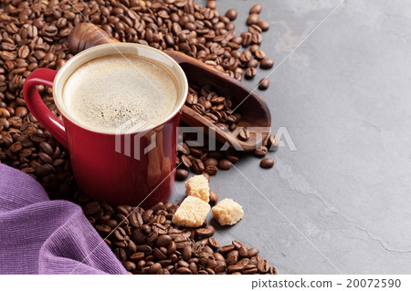 Coffee cup, beans and brown sugar on stone table 20072590
