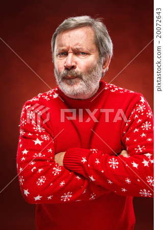 The expressive portrait on red background of a 20072643