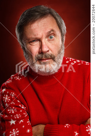 The expressive portrait on red background of a 20072644