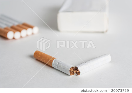 Anti-smoking background with broken cigarette Anti-smoking background with broken cigarette 20073739