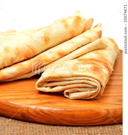 Lavash, tortilla wrap Bread on the cutting board Lavash, tortilla wrap Bread on the cutting board 20074671