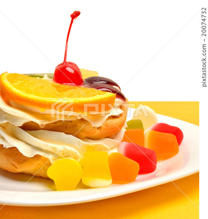 Christmas fruit cake with cream on white plate  20074732