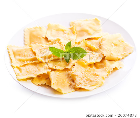 plate of ravioli with basil  on white background 20074878