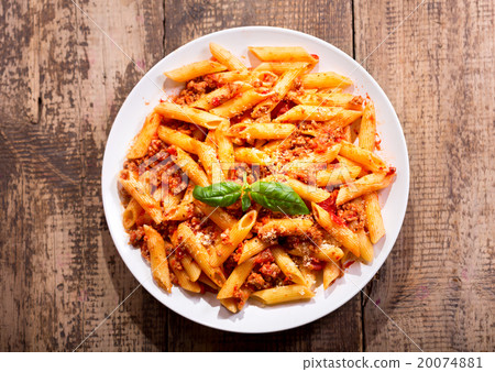 plate of penne pasta bolognese 20074881