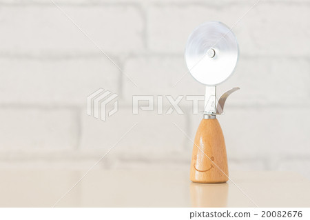 Pizza cutter knife on table 20082676