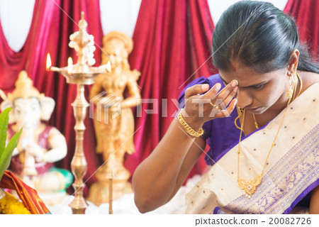 Hindu woman putting bindi Hindu woman putting bindi 20082726