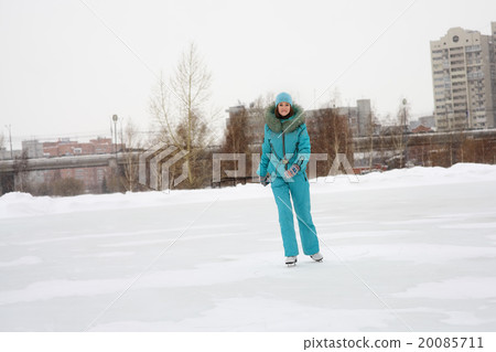 Young girl skating on the frozen lake Young girl skating on the frozen lake 20085711