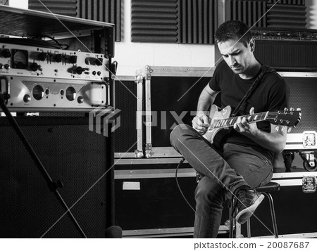 Guitarist playing backstage 20087687
