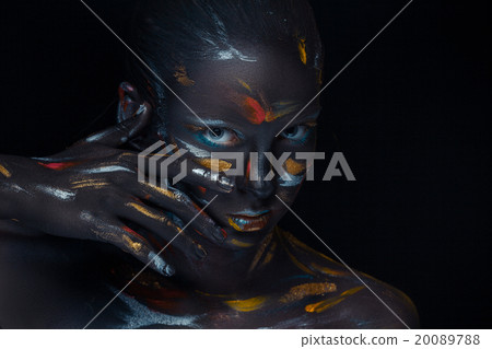 Portrait of a young woman who is posing covered 20089788