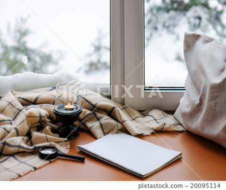 Open notepad, magnifier glass, pillow, candle Open notepad, magnifier glass, pillow, candle 20095114