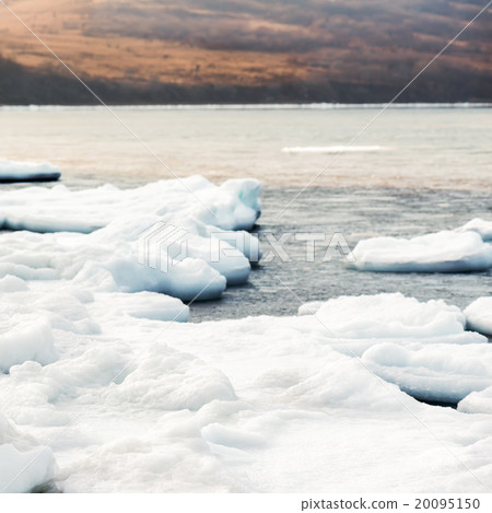 Natural sea ice blocks breaking up against shore. Natural sea ice blocks breaking up against shore. 20095150