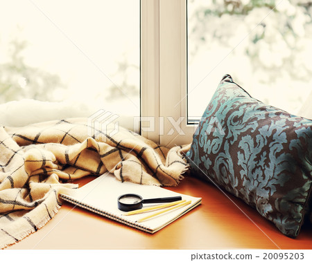 Open notepad, magnifier glass, pillow, pencils Open notepad, magnifier glass, pillow, pencils 20095203