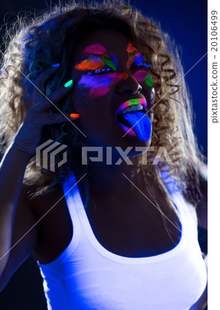Image of funny girl posing at camera in UV light Image of funny girl posing at camera in UV light 20106499