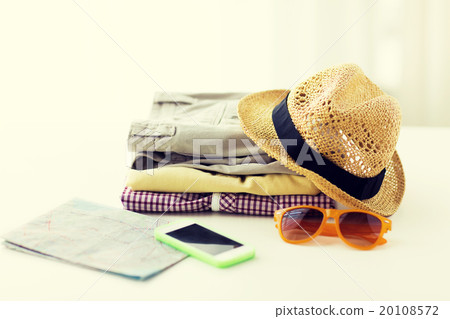 close up of summer clothes and travel map on table 20108572