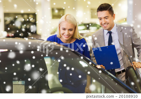 happy woman with car dealer in auto show or salon 20108910