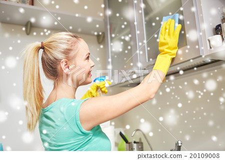 happy woman cleaning cabinet at home kitchen 20109008