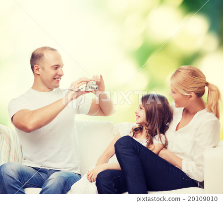 happy family with camera at home happy family with camera at home 20109010