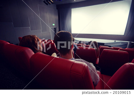 happy couple watching movie in theater or cinema happy couple watching movie in theater or cinema 20109015