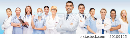 group of smiling doctors with clipboard group of smiling doctors with clipboard 20109125