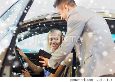 happy woman with car dealer in auto show or salon happy woman with car dealer in auto show or salon 20109193