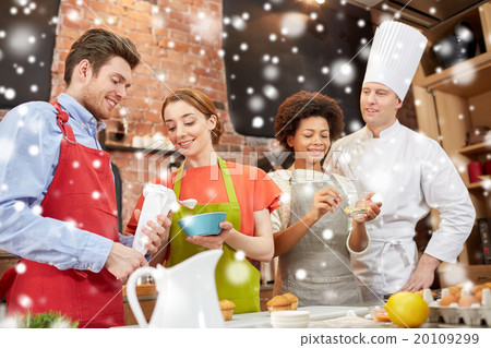 happy friends and chef cook baking in kitchen happy friends and chef cook baking in kitchen 20109299
