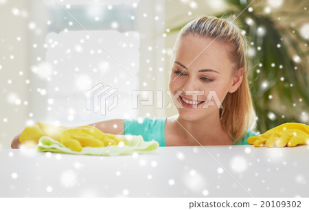 happy woman cleaning table at home kitchen 20109302