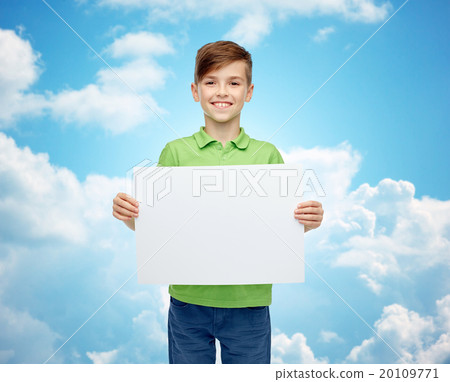 happy boy in t-shirt holding white blank board happy boy in t-shirt holding white blank board 20109771