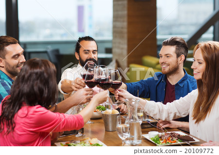 friends dining and drinking wine at restaurant friends dining and drinking wine at restaurant 20109772